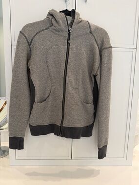 Lululemon women’s Gray Full-Zip Hooded Jacket. Size 6. Small stain in cuff.